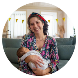 image shows woman holding a baby